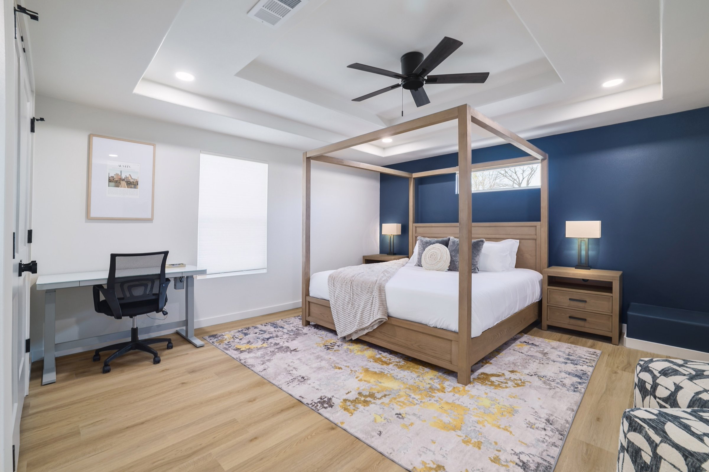 Austin East Bird primary suite with wood canopy bed