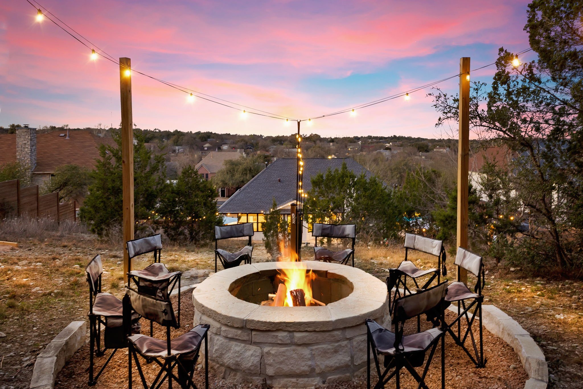 Cowboy Ridge fire pit at sunset with Adirondack chairs